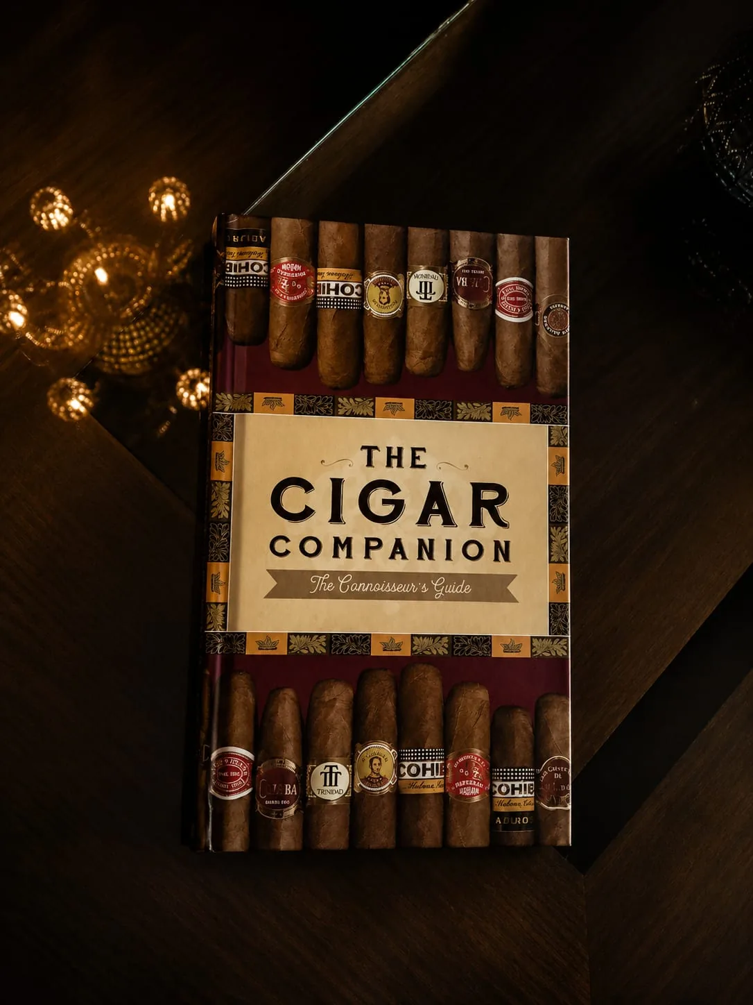 The Cigar Companion connoisseur's guide resting on a dark wooden table